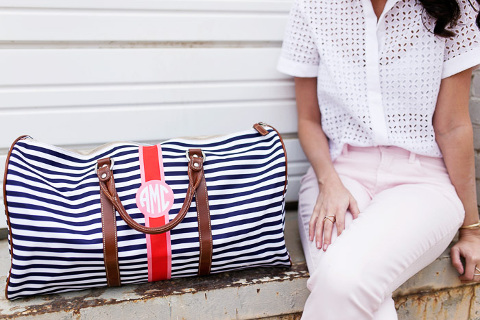 Amanda Miller sitting next to the Belmont Cabin striped bag from Barrington Gifts