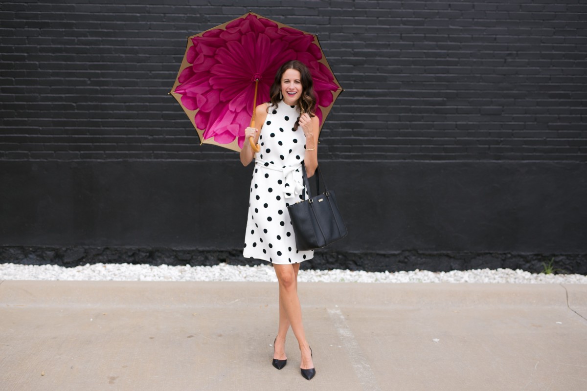 Amanda Miller holding a pink and black brellini umbrella for Work Wear Wednesday