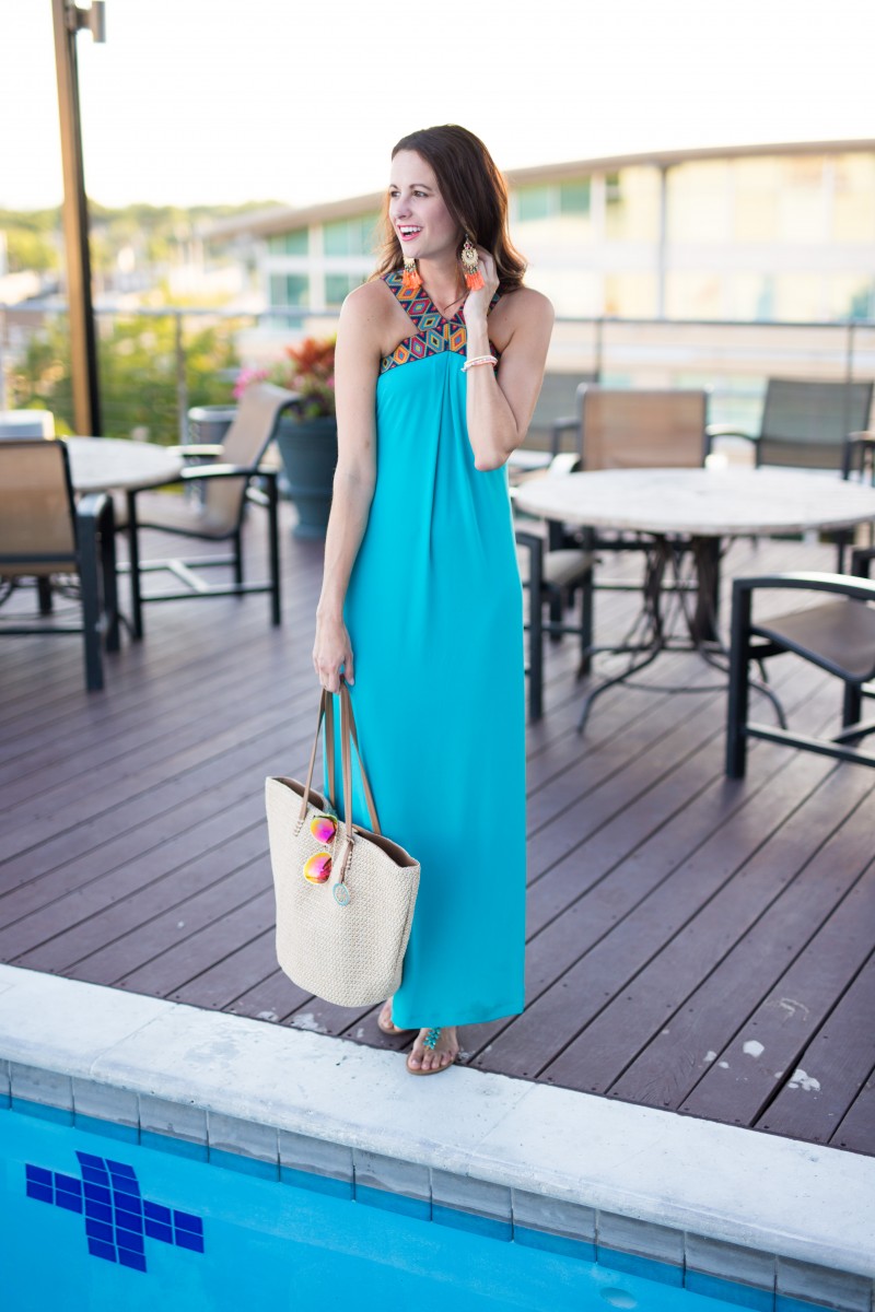 The Miller Affect holding a straw tote from NY & Co and wearing a blue maxi dress