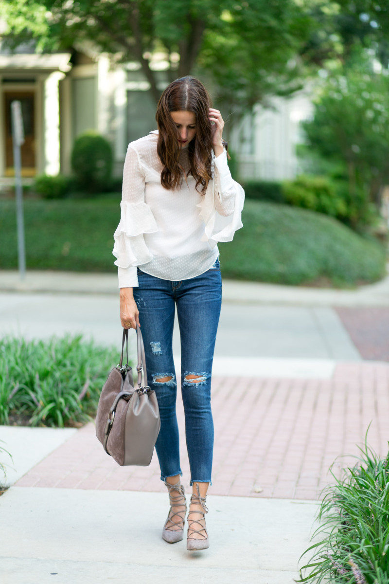 Amanda Miller wearing an ivory Olivia Palermo top and distressed jeans from Nordstrom