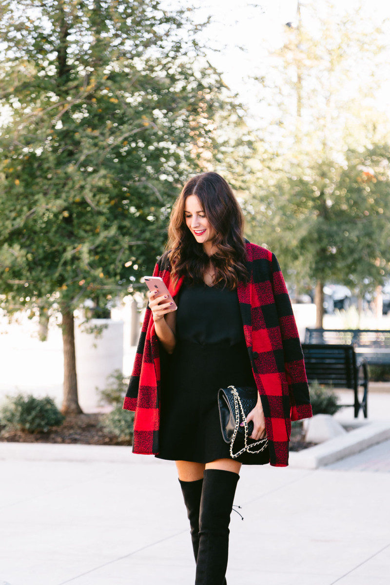 The Miller Affect wearing red plaid coat and a black flare skirt