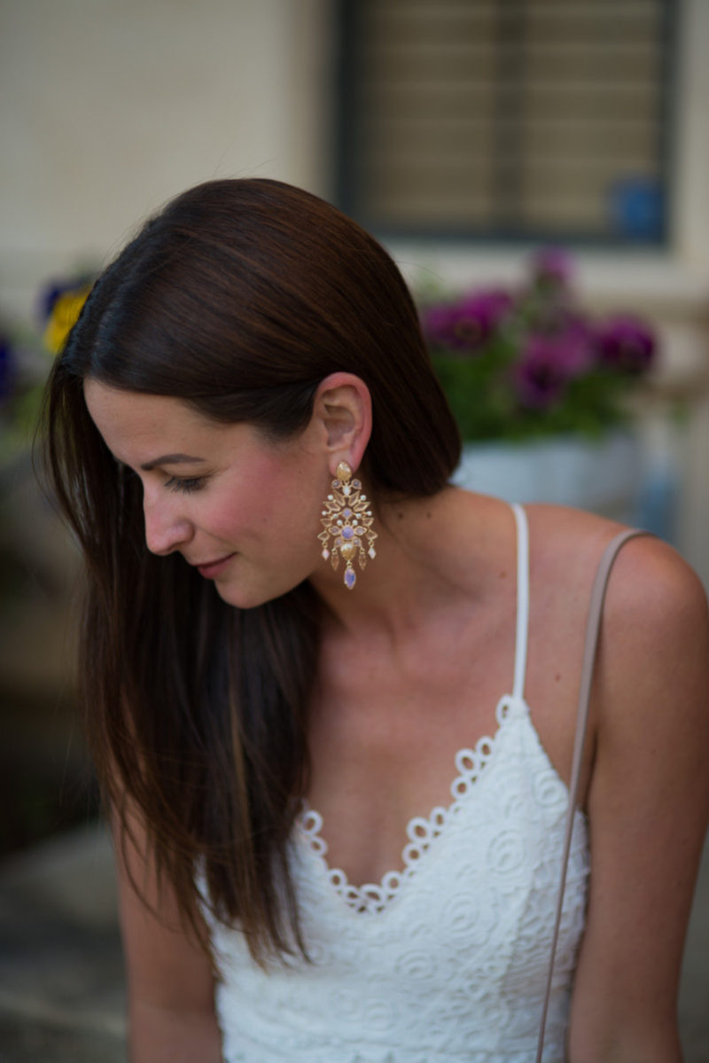The Miller Affect wearing rose gold chandelier earrings from kendra scott