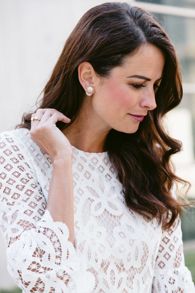 The miller affect wearing pearl studs from Kate Spade