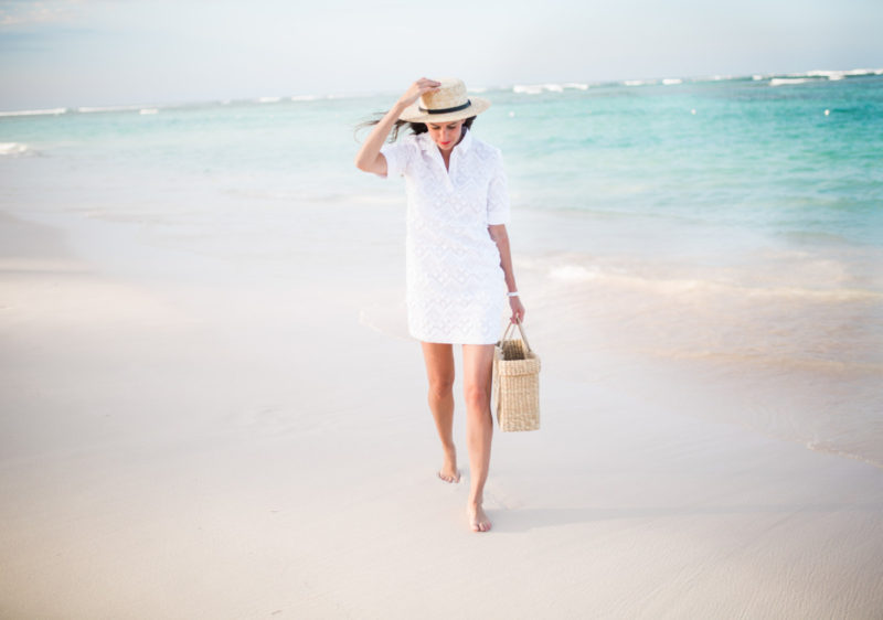 The Miller Affect walking on the beach in a white summer dress
