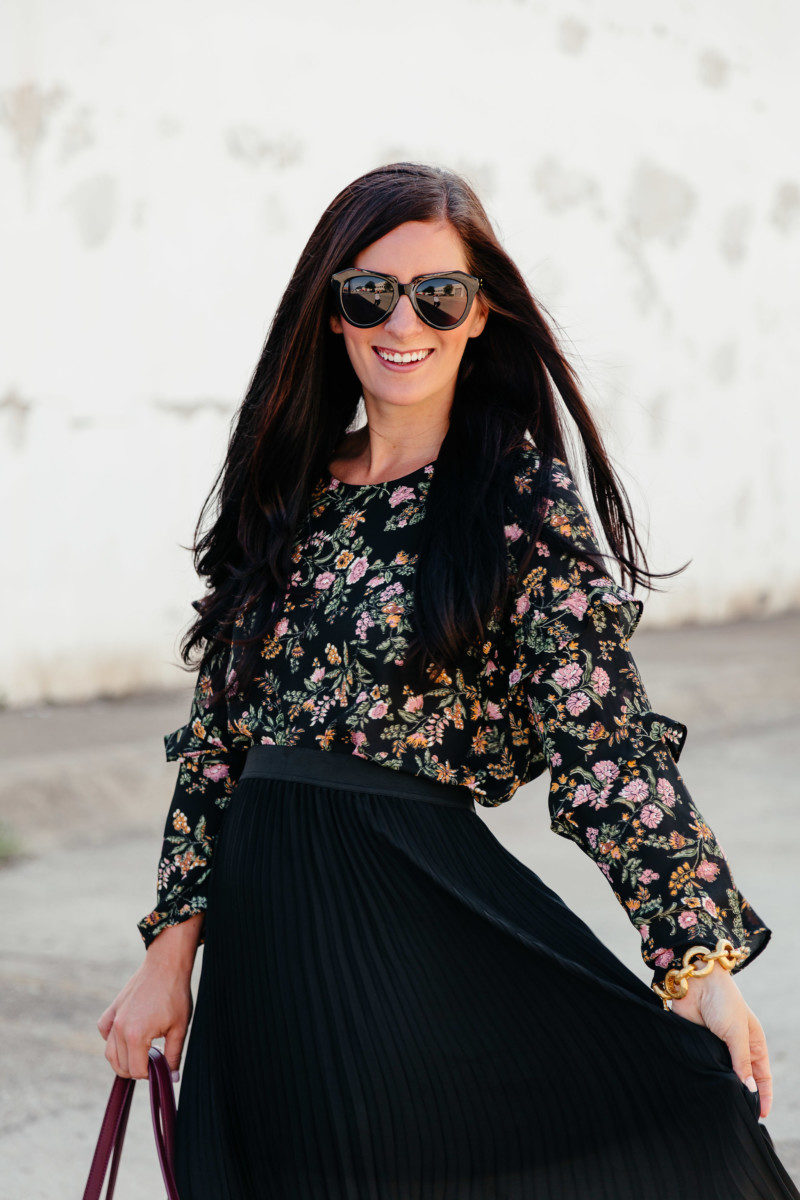 Lynlee Poston wearing a black pleated skirt from the Nordstrom Anniversary Sale