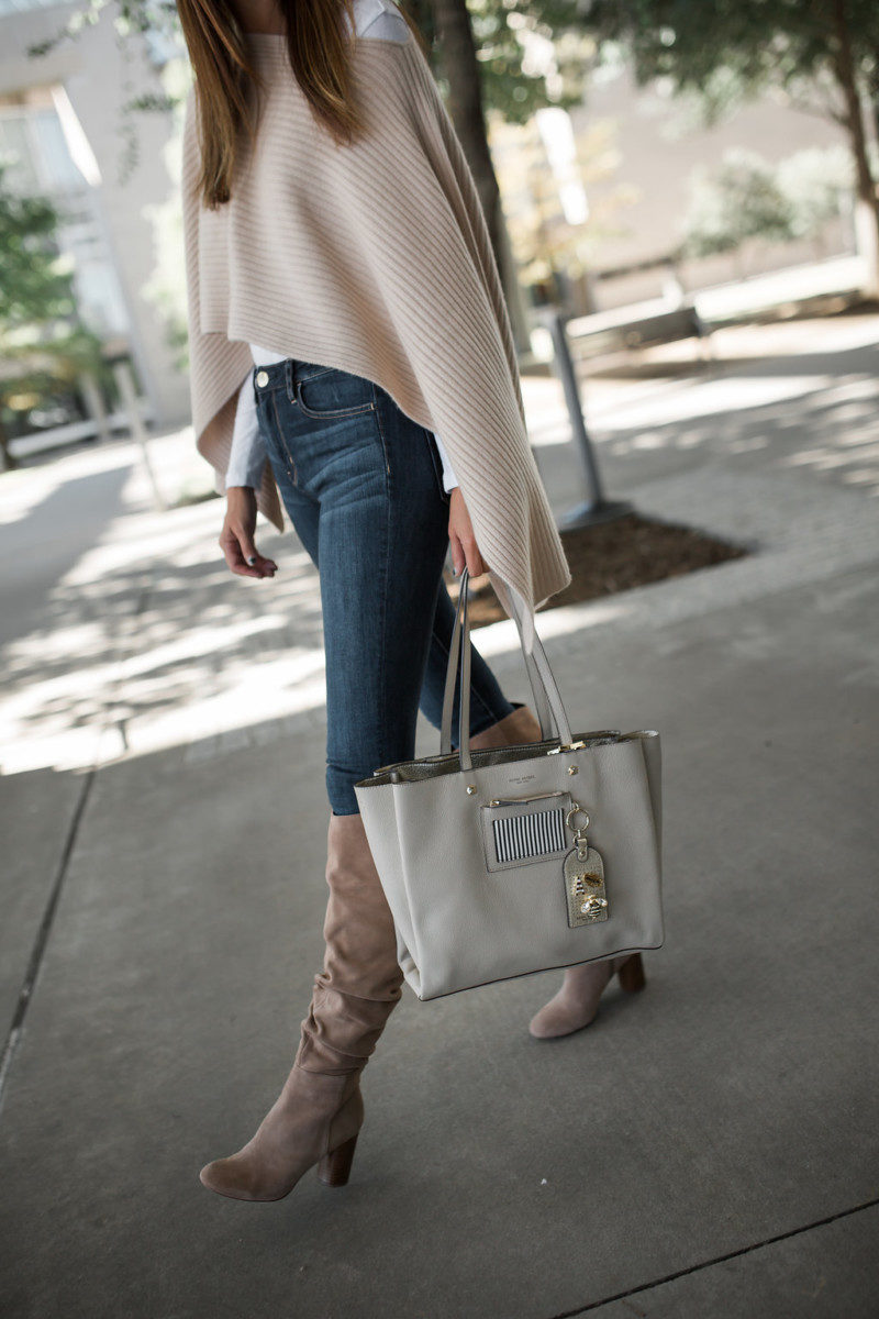 the miller affect carrying a feather grey influencer tote from henri bendel