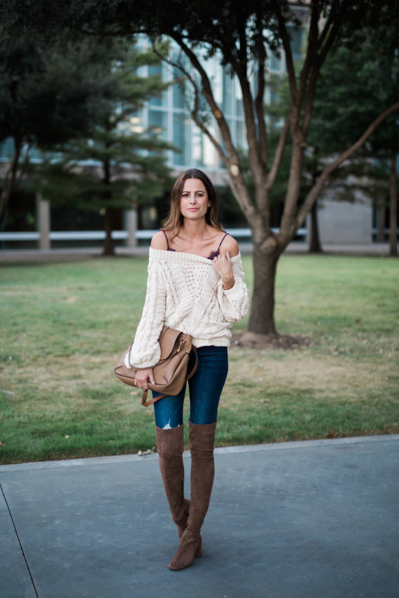 The Miller Affect wearing an oversized off the shoulder sweater with a lace cami