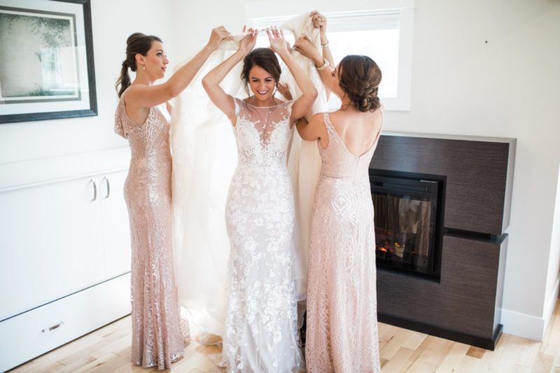 The MIller Affect, mother, and two sisters, putting on her wedding dress