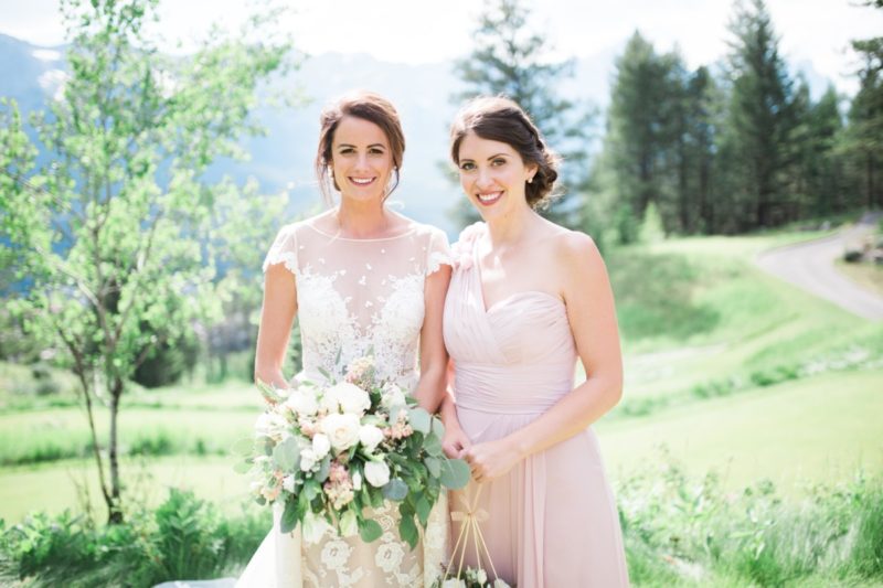 The Miller Affect wearing a pink bridesmaid dress from WTOO Watters