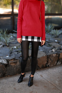 red chunky sweater and long plaid tunic