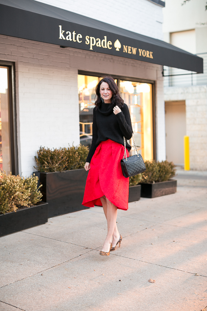 black turtleneck, red skirt