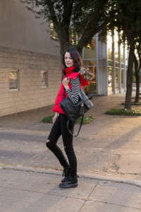 black leather backpack, ref puffer vest from Gap, black jeans,black duck boots