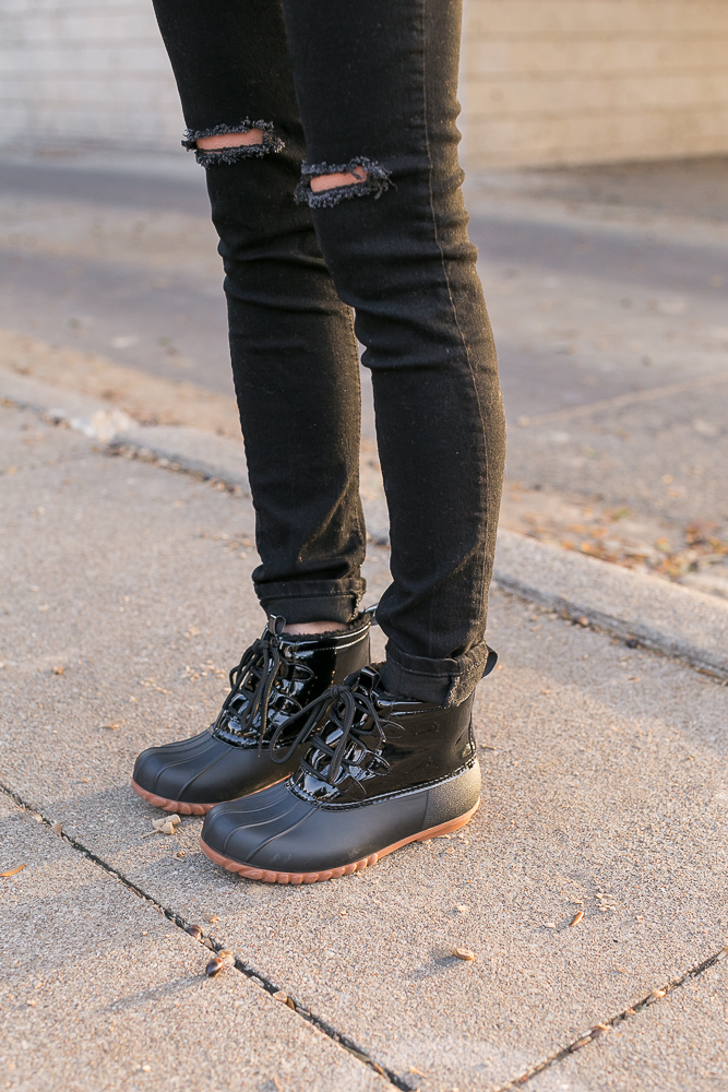 black duck boots, black distressed jeans