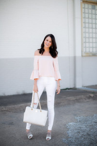 The Miller Affect wearing a blush pink off the shoulder top