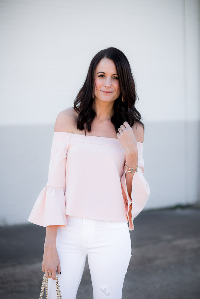 Amanda Miller wearing a pink off the shoulder bell sleeved top from Asos