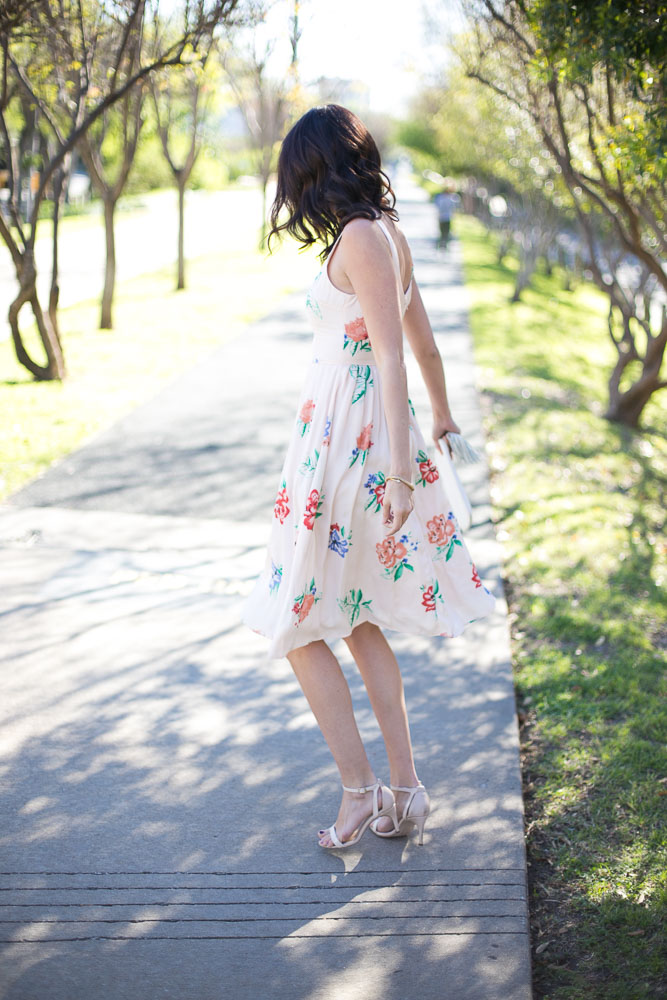 The Miller Affect twirling in a blush dress and nude heeled sandals