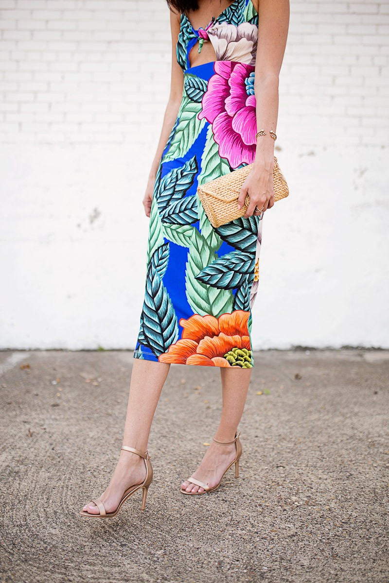 Amanda miller wearing metallic heels and a tropical midi dress