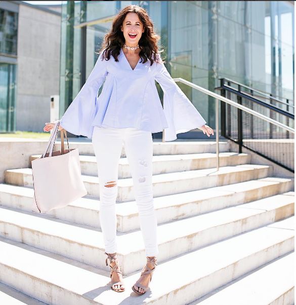 Blue bell sleeved blouse with white distressed skinny jeans