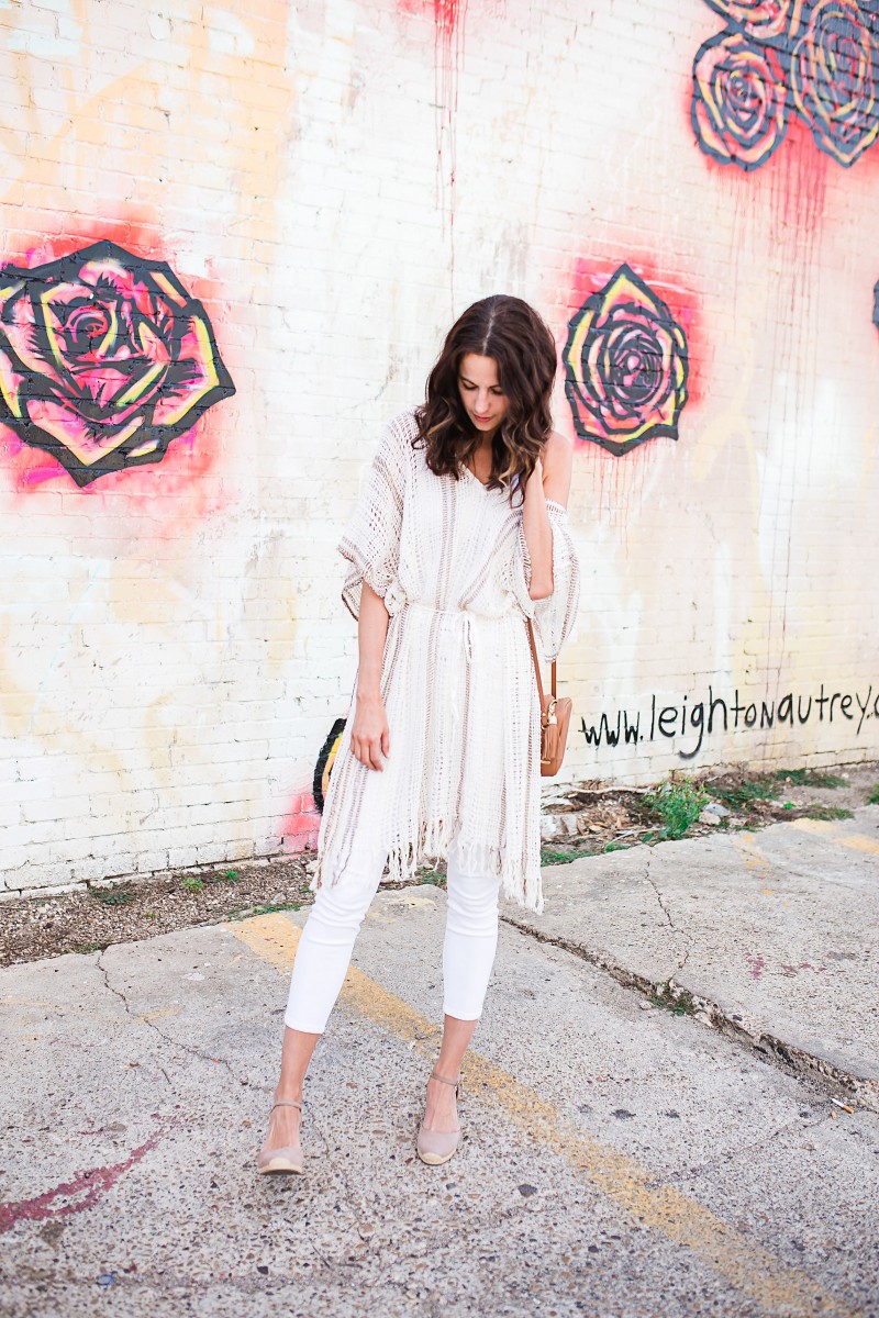 Amanda Miller wearing an ivory crochet cover up, white leggings, and beige wedges