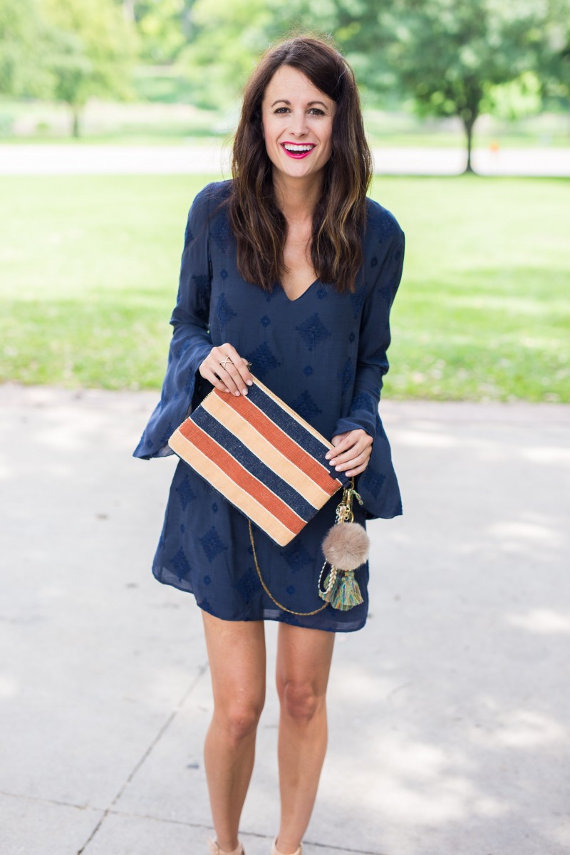 Amanda Miller holding a cute summer clutch from The Bagtique