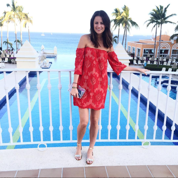 Amanda Miller wearing a red Storee lace off the shoulder dress