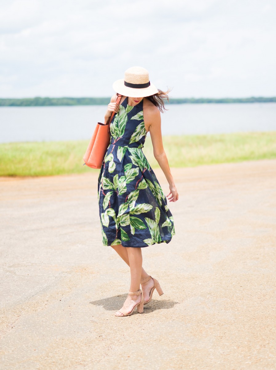 The Miller Affect wearing a straw boater hat and the Amalfi Halter Dress from Ann Taylor