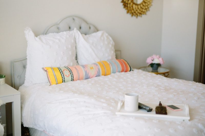 A photo of the bedroom of The Miller Affect with a Nordstrom Allie Duvet and a One King's Lane Gray Headboard