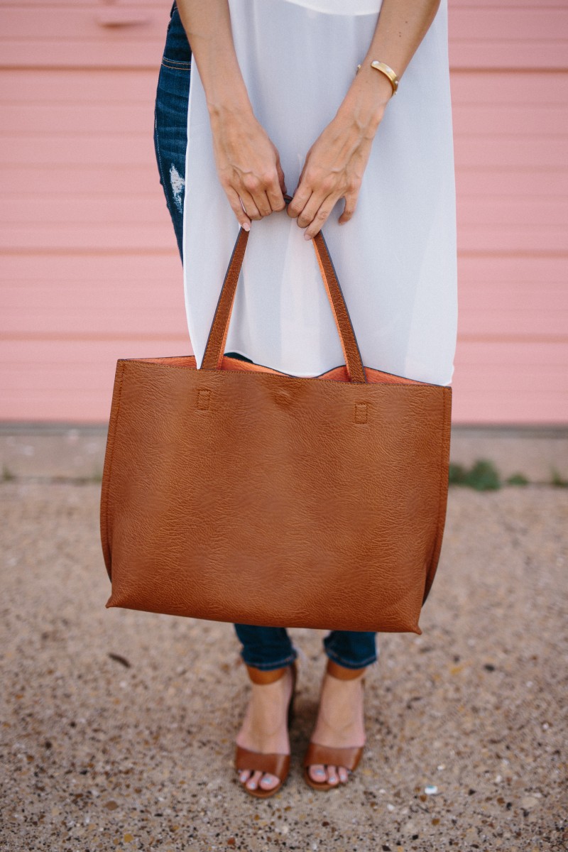 The Miller Affect wearing cognac heeled sandals and a cognac reversible tote