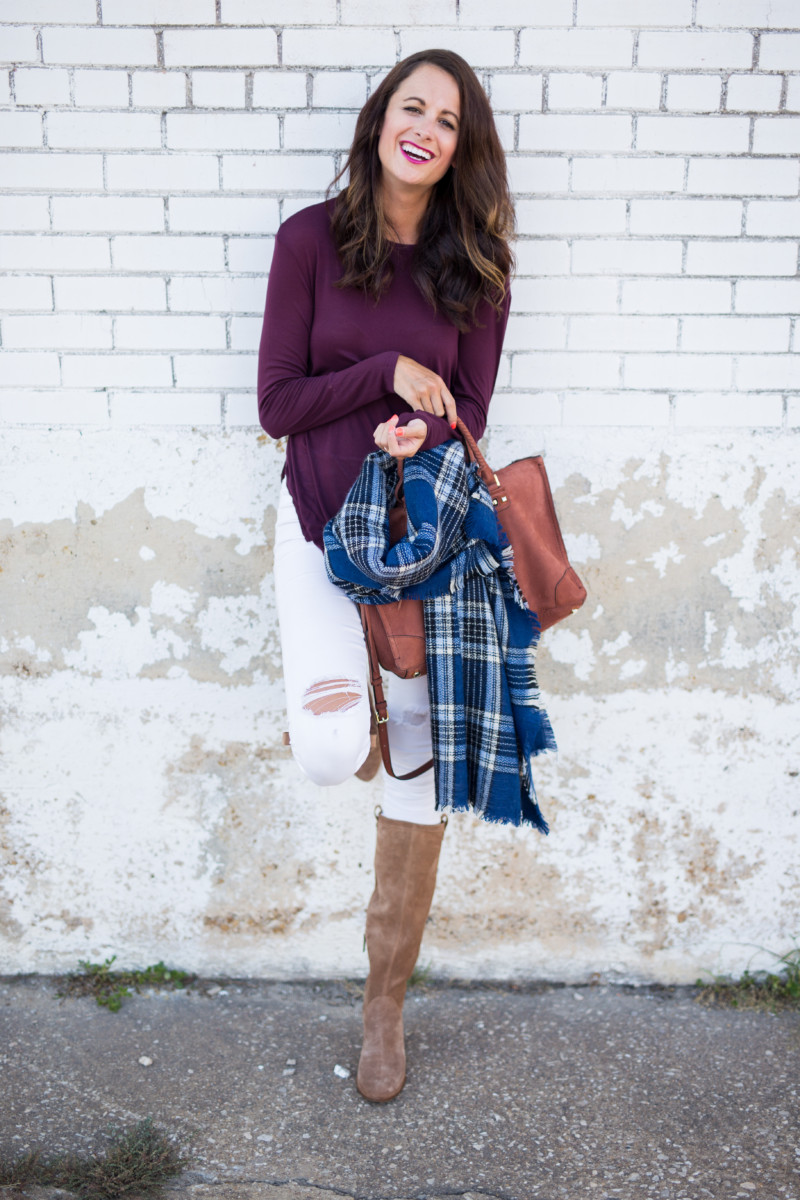 Amanda Miller wearing a burgundy tunic and a navy blue plaid blanket scarf