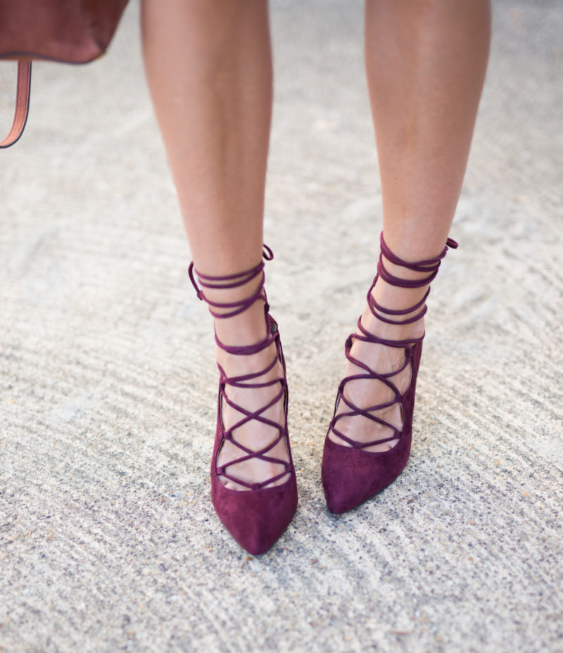 The Miller Affect wearing burgundy lace up heels
