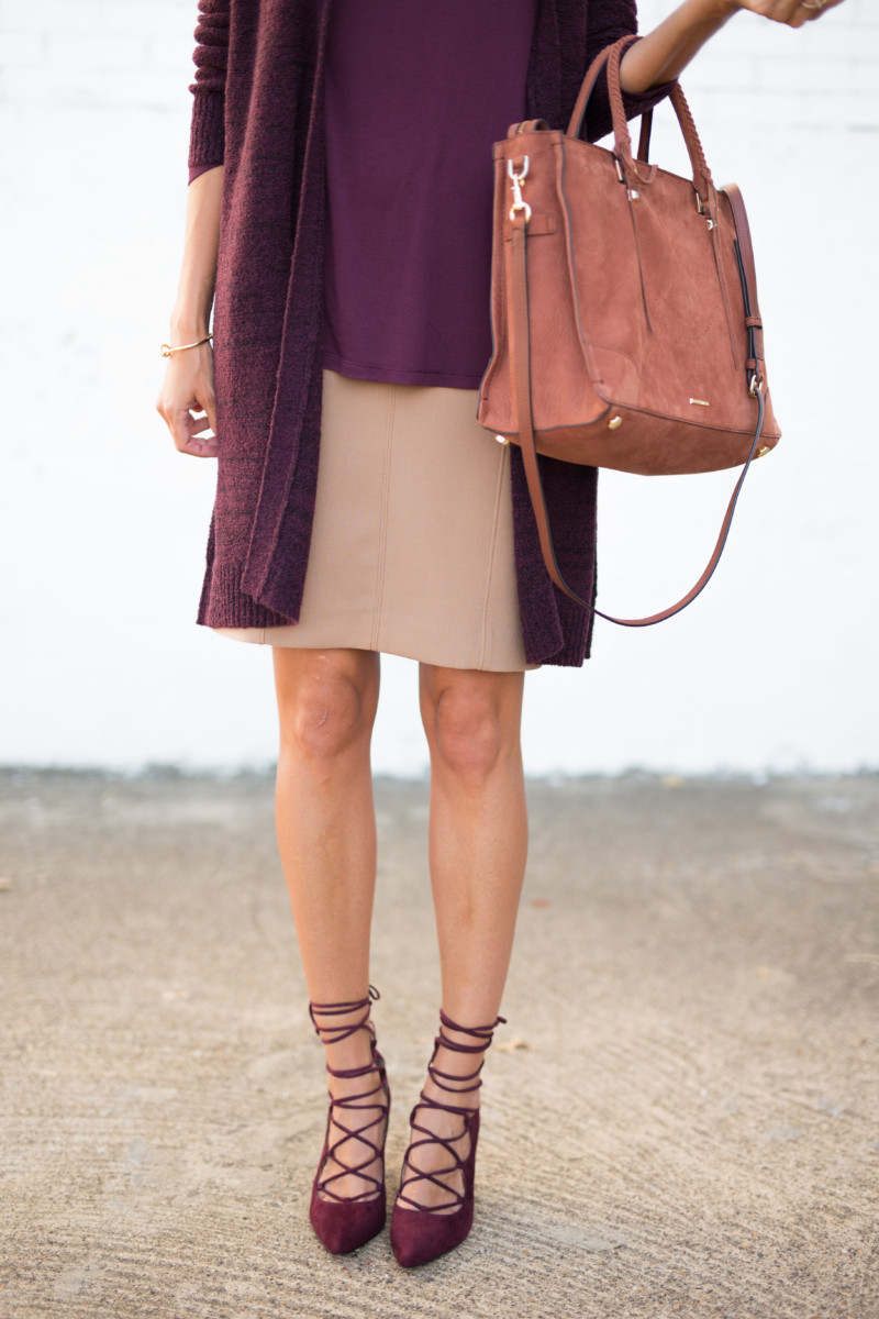 The Miller Affect wearing a dark camel skirt with a burgundy cardigan