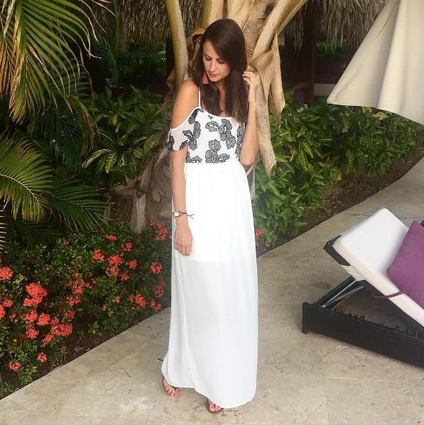 The Miller Affect wearing a white embroidered maxi dress on sale for under $40