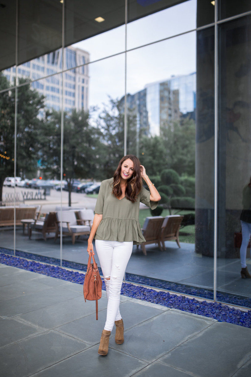 Amanda Miller wearing white distressed jeans and khaki suede boots from Nordstrom