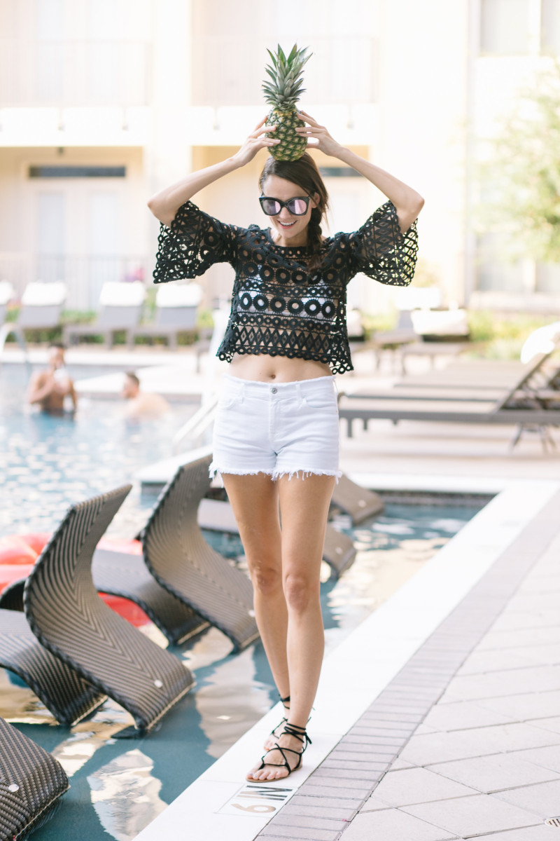 The Miller Affect wearing a black crochet top with belle sleeves for What to Wear to a Pool Party