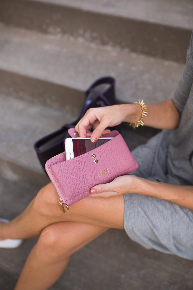 The Miller Affect holding the pink city wallet from gigi new york