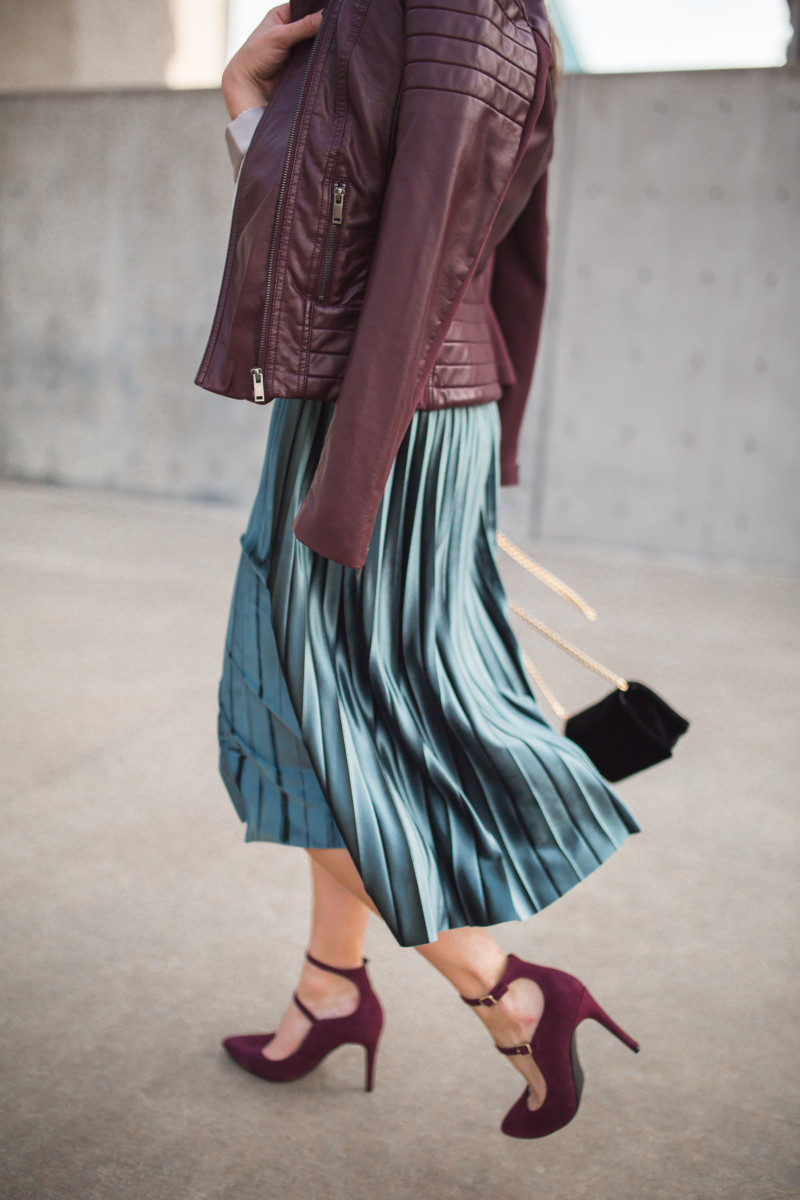 Fashion and Frills in a velvet pleated midi skirt and burgundy leather jacket