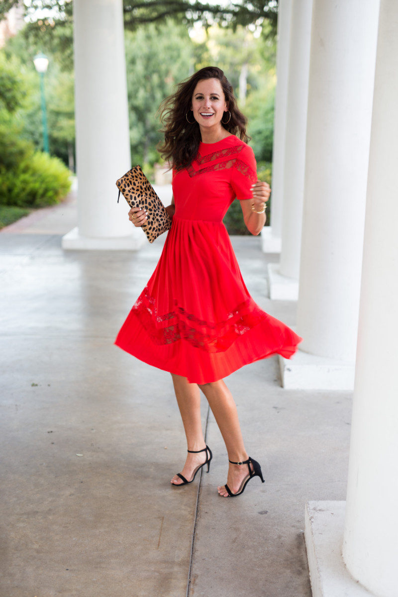 The Miller Affect wearing a red lace dress and hosting a Palm Beach Tan Giveaway