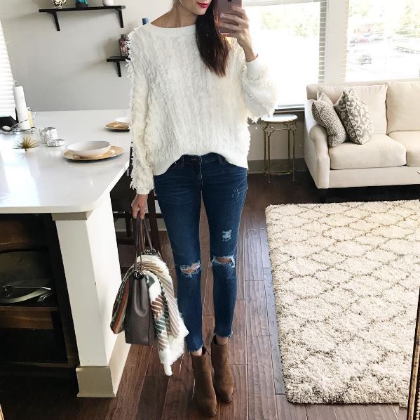 The Miller Affect in an ivory fringe sweater