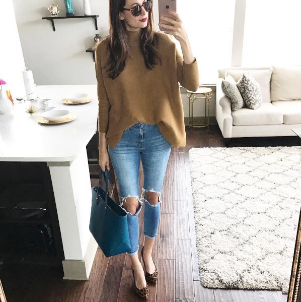 The Miller Affect in a camel sweater from Chicwish and distressed Levi jeans