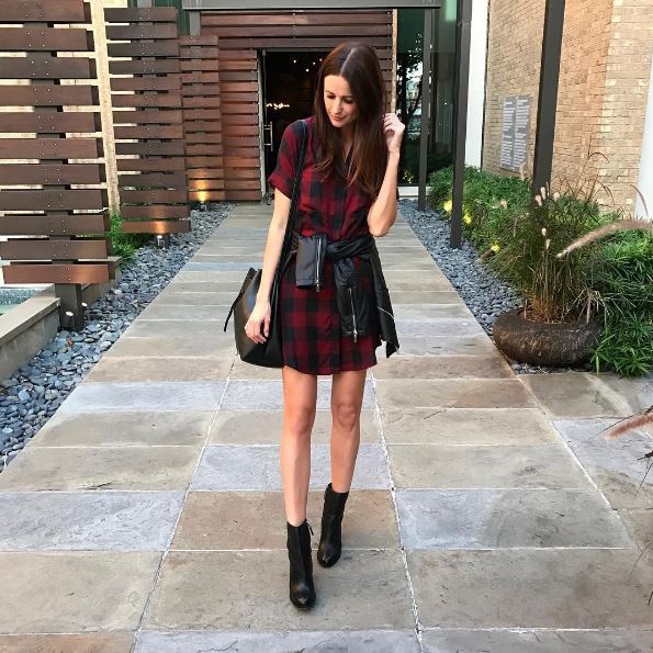 The Miller affect in a Madewell plaid shirt dress, a leather jacket, and leather booties