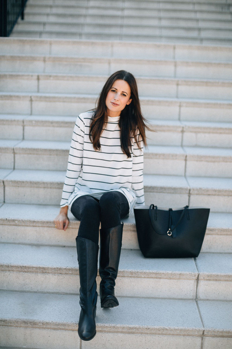 The Miller Affect in a white and black striped mock neck top