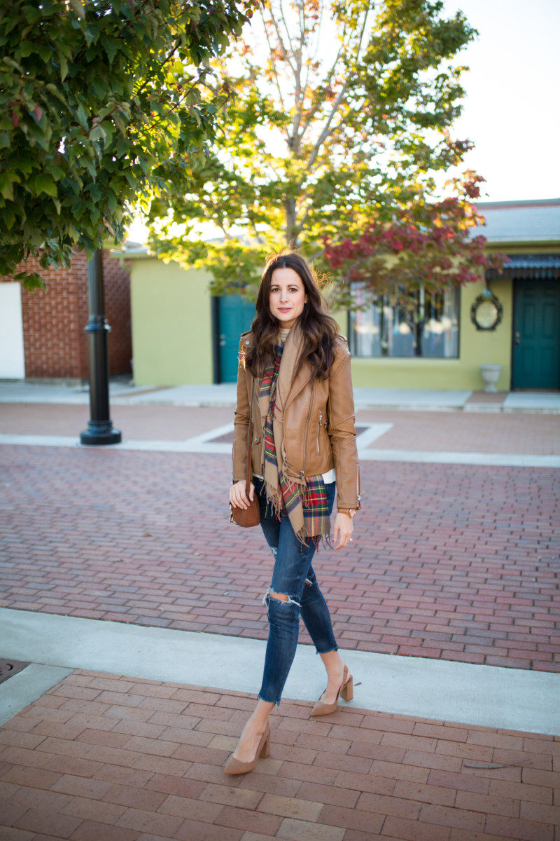 The Miller Affect wearing a tan leather jacket and tan slingback pumps