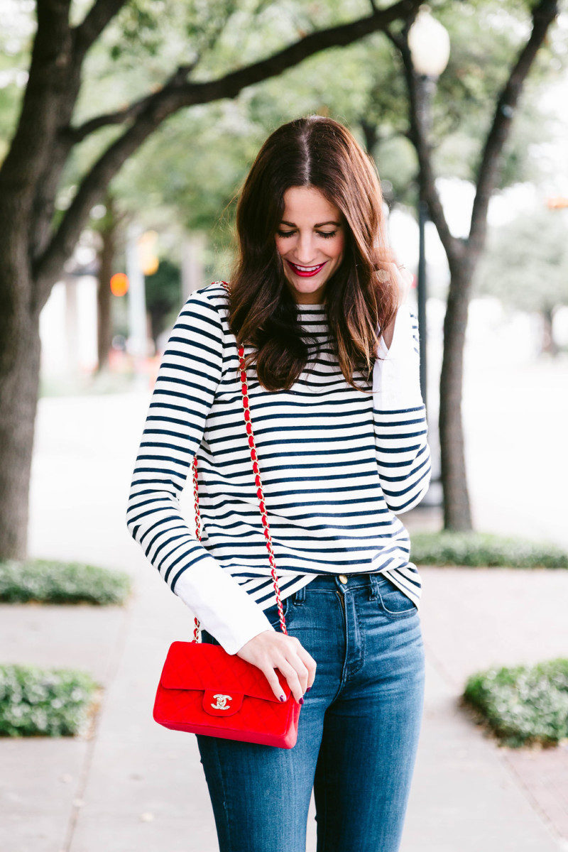 The Miller Affect carrying a red Chanel crossbody and wearing a striped J.Crew top
