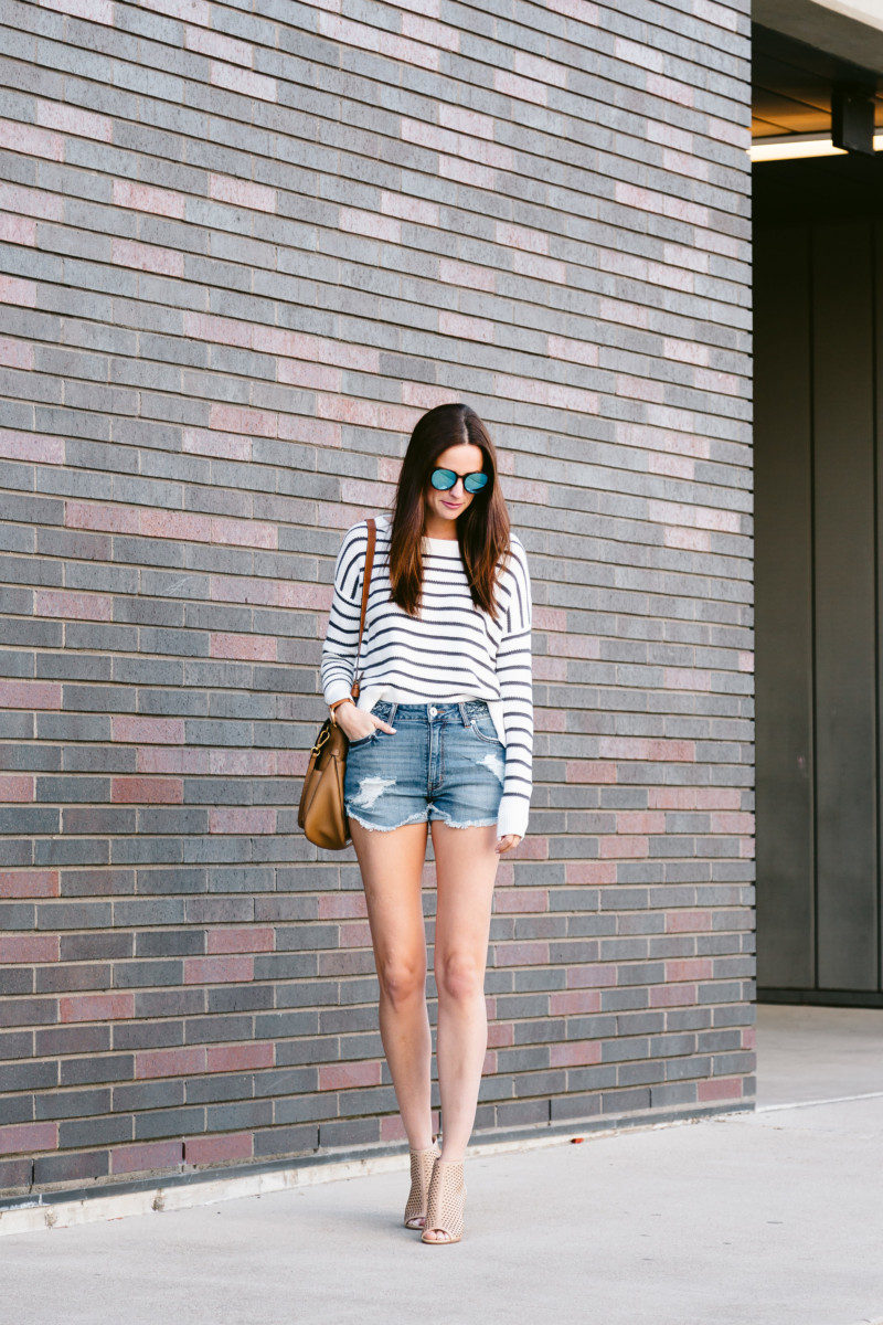 The miller Affect wearing a striped top and braided denim jean shorts from Nordstrom