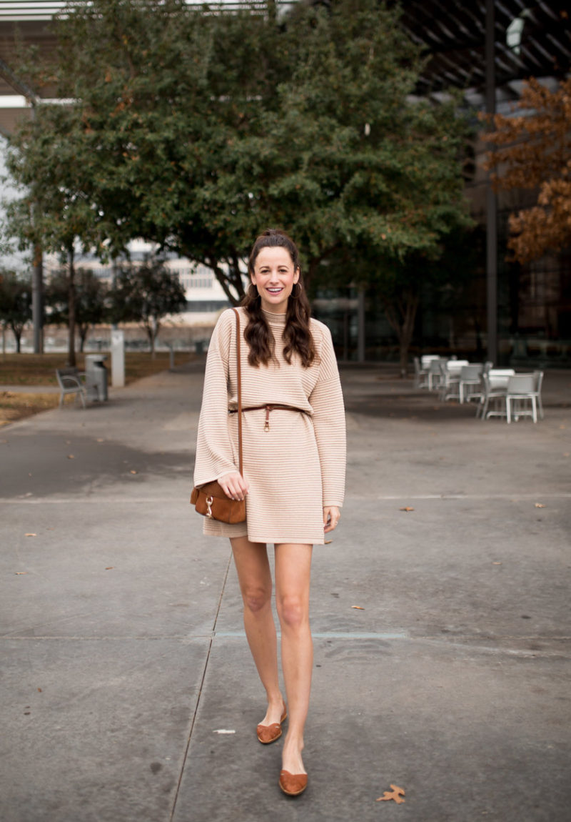The Miller Affect in a tan sweater dress with bell sleeves