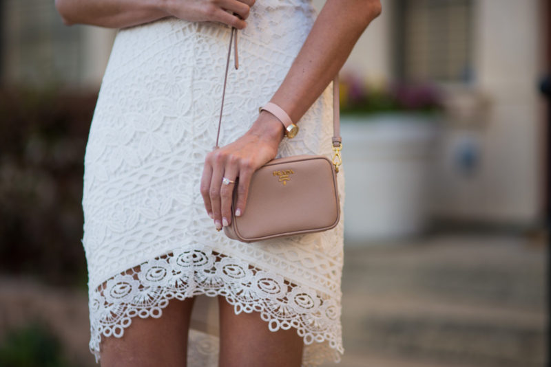 The Miller Affect wearing the prettiest white lace dress with a Prada saffiano cammeo camera bag