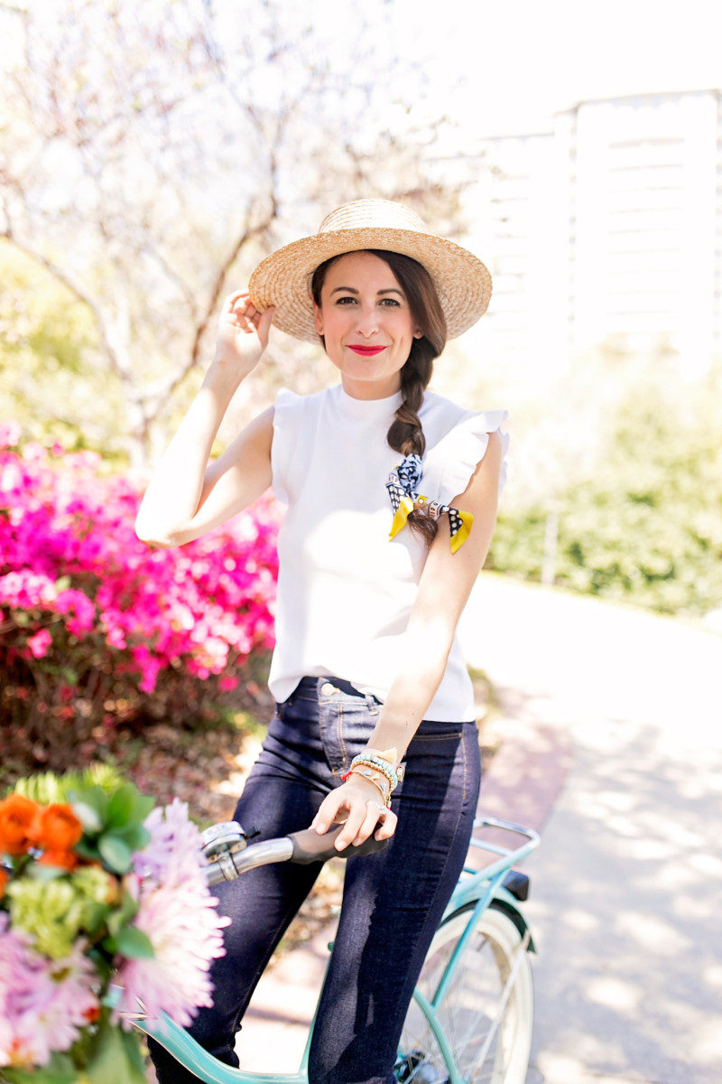 The Miller Affect wearing a straw panama hat from Sole society and a white ruffle sleeveless blouse from ann taylor