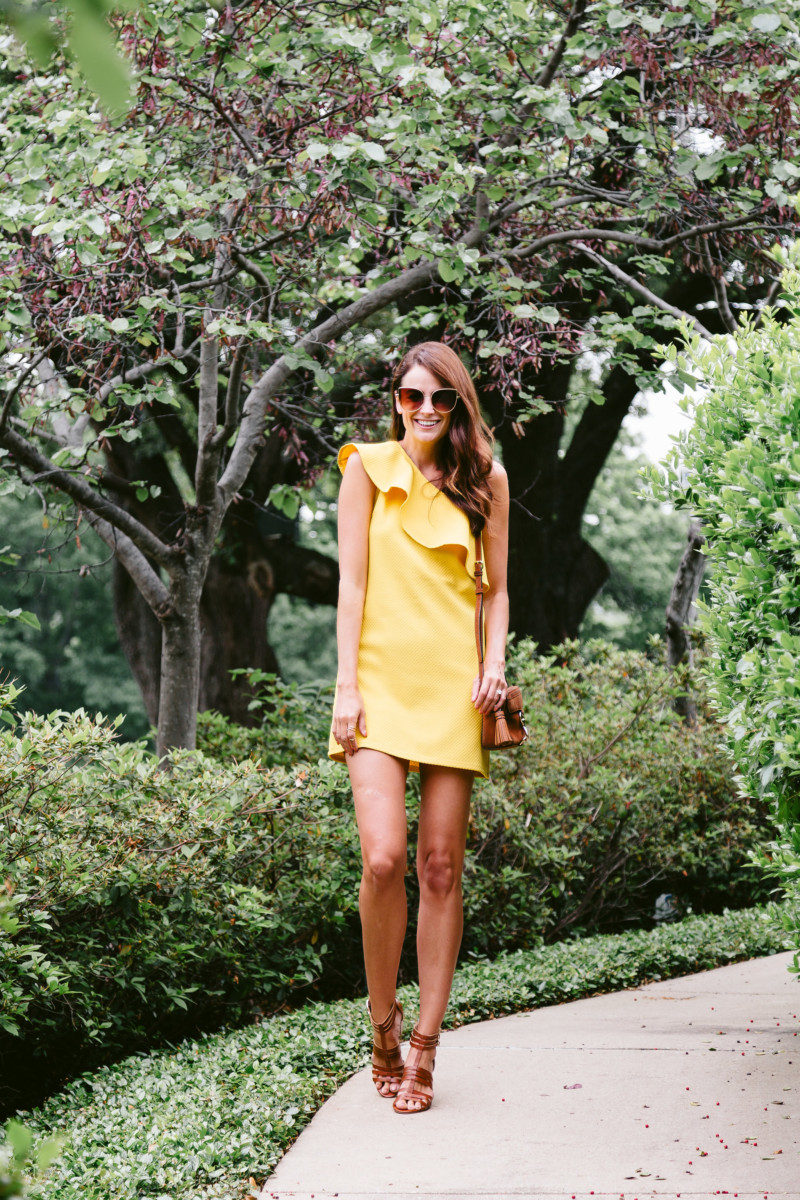 The Miller Affect wearing a yellow dress from cupcakes and cashmere