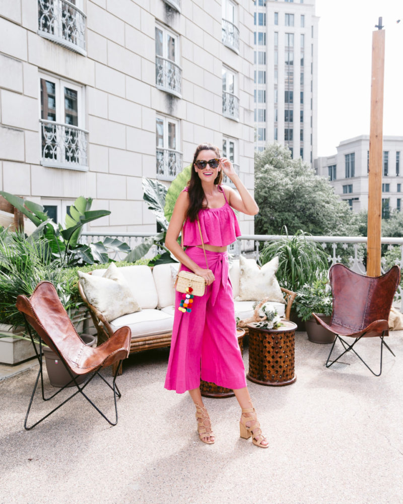 The Miller Affect wearing a hot pink set with dolce vita sandals and a nannacay bag