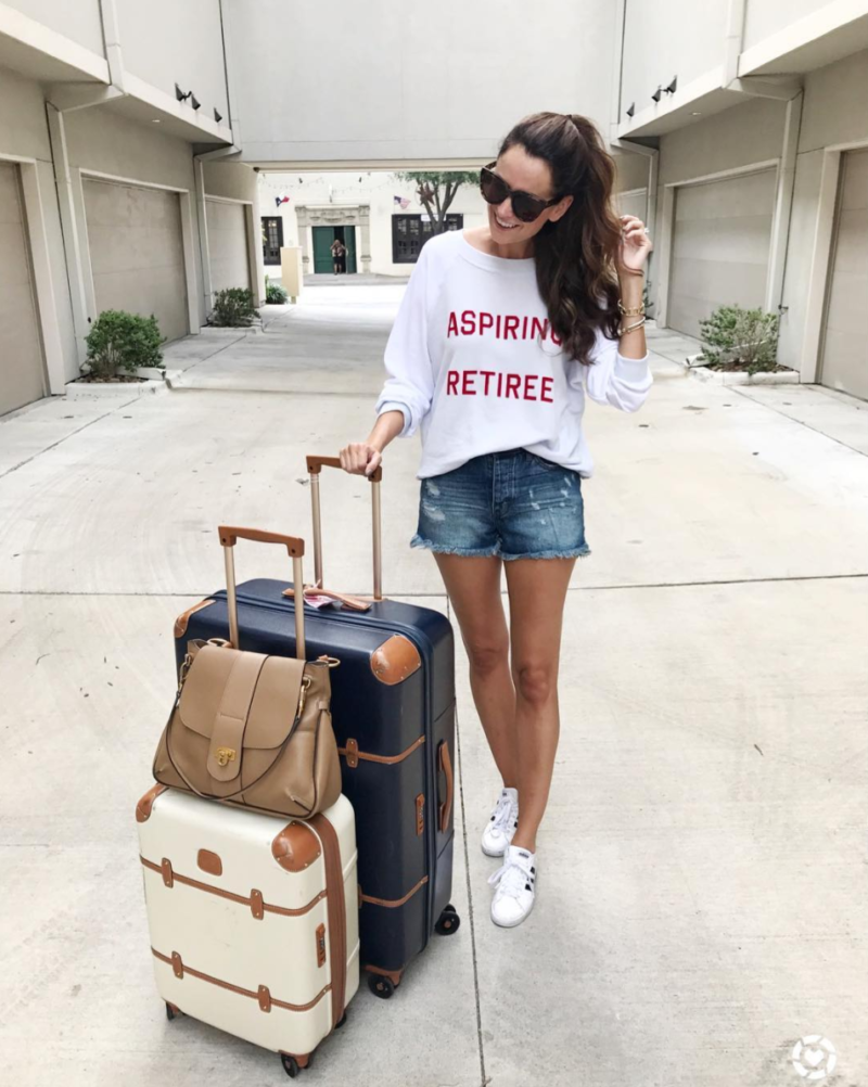 the miller affect travel look to palm springs with Bric's luggage and wearing an aspiring retiree sweatshirt by wildfox